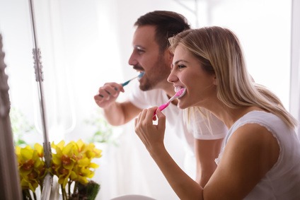 Couple washing teeth in morning, dental hygiene is important